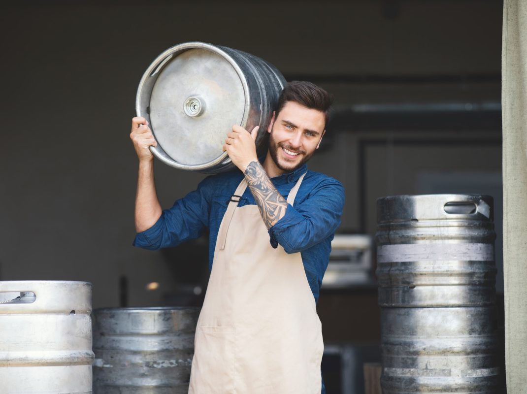 strong-warehouse-worker-brewery-owner-working-at-plant-small-business-and-success-emotions.jpg